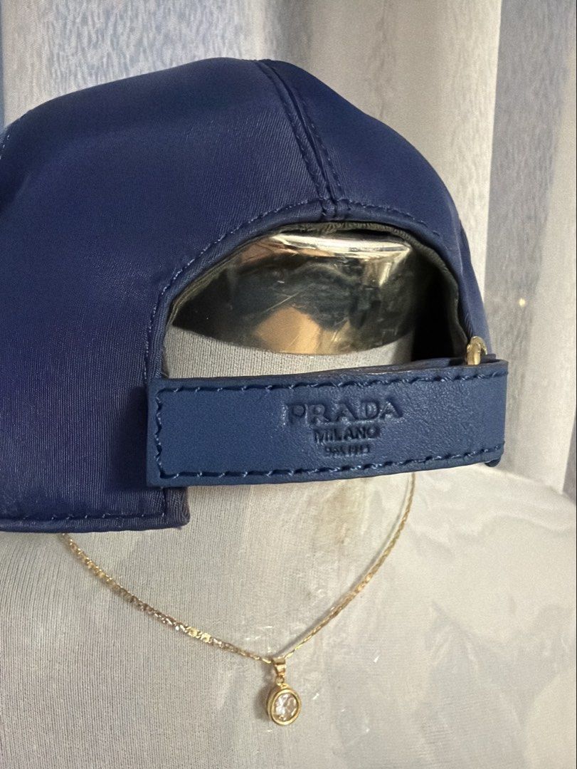 Blue Nylon Cap with Dust Bag and Box (Category: Luxury Accessories) located in Santa Cruz. Submitted by imkikay (Listing ID 1461233201, Image 3). Description: - Includes dust bag and box (there’s a rip on 1 edge) - Ideal for everyday wear - Feel free to ask any questions.