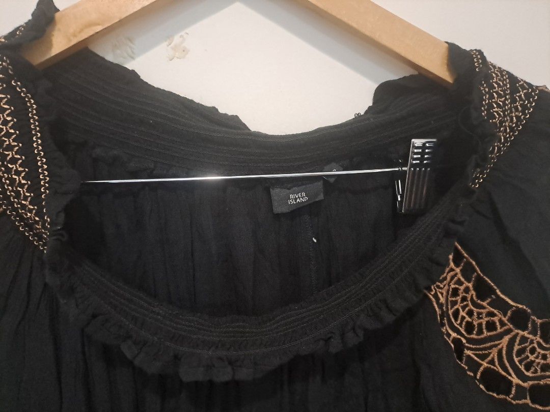 Bohemian off shoulder (Category: Longsleeves) located in Manila. Submitted by joanbalde39643 (Listing ID 1461235445, Image 2). Description: This River Island off-shoulder peasant blouse features a lightweight black cotton fabric accented with intricate, contrast tan crochet panels and floral embroidery across the shoulders and sleeves. It is designed with elasticated bardot trims and flared, scalloped cuffs for a relaxed bohemian silhouette..