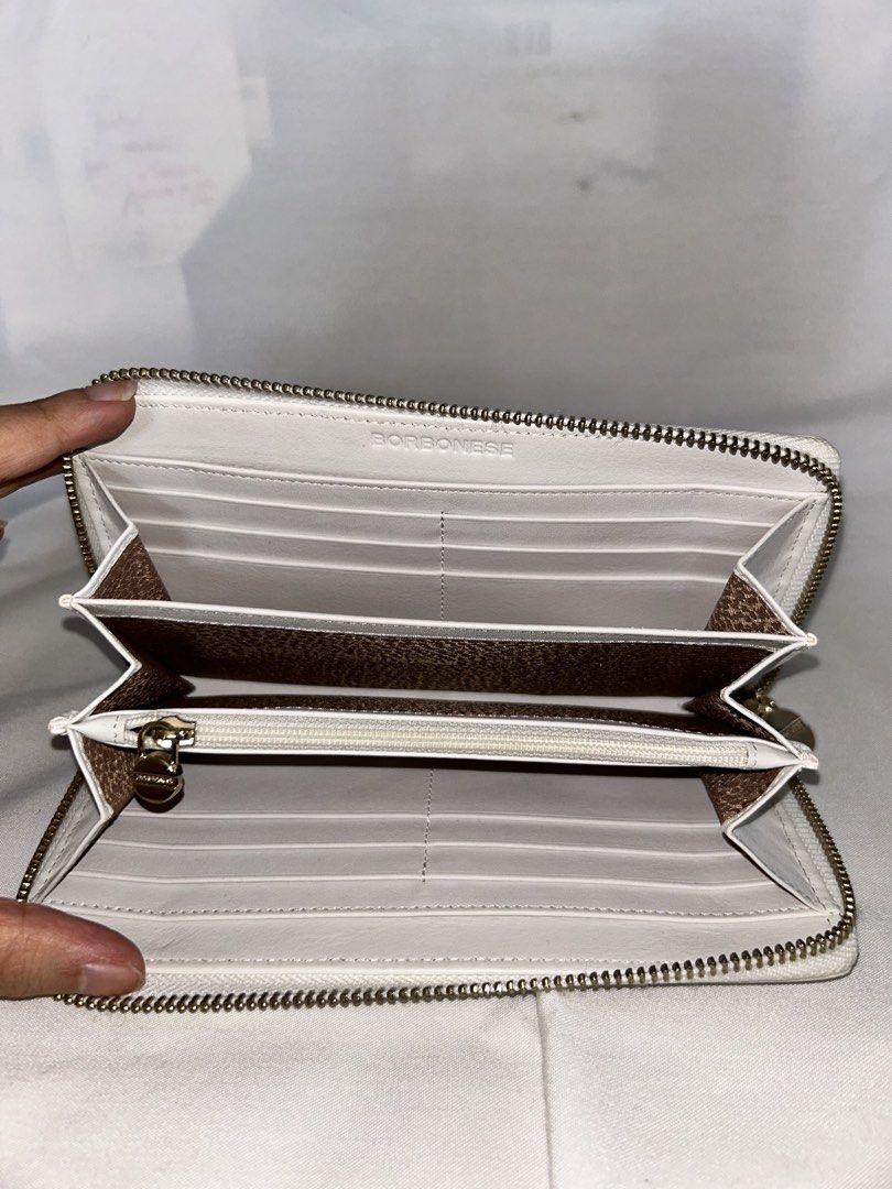 BORBONESE White Leather Zip Around Wallet (Category: Wallets & Card holders) located in Paranaque City. Submitted by annekathleen (Listing ID 1461178340, Image 3). Description: - BORBONESE White leather zip-around wallet - With several card slots and compartments - Comes with dust bag .