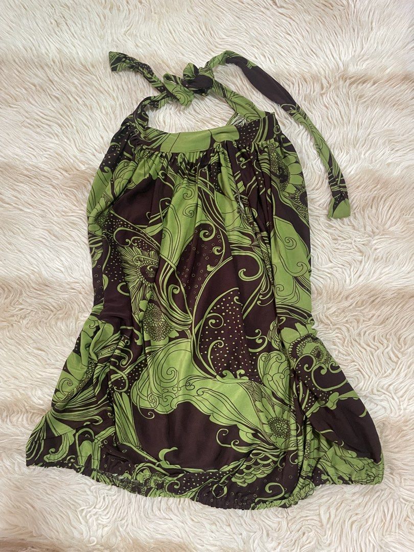 Brown and Green Floral Halter Top (Category: Dresses) located in Manila. Submitted by prelovedsbypink (Listing ID 1461295911, Image 1). Description: - Flowy maxi dress - Brown and green floral print - Halter neck with tie closure - Elasticated hem - Ideal for beach vacations or summer outings - Comfortable and stylish.
