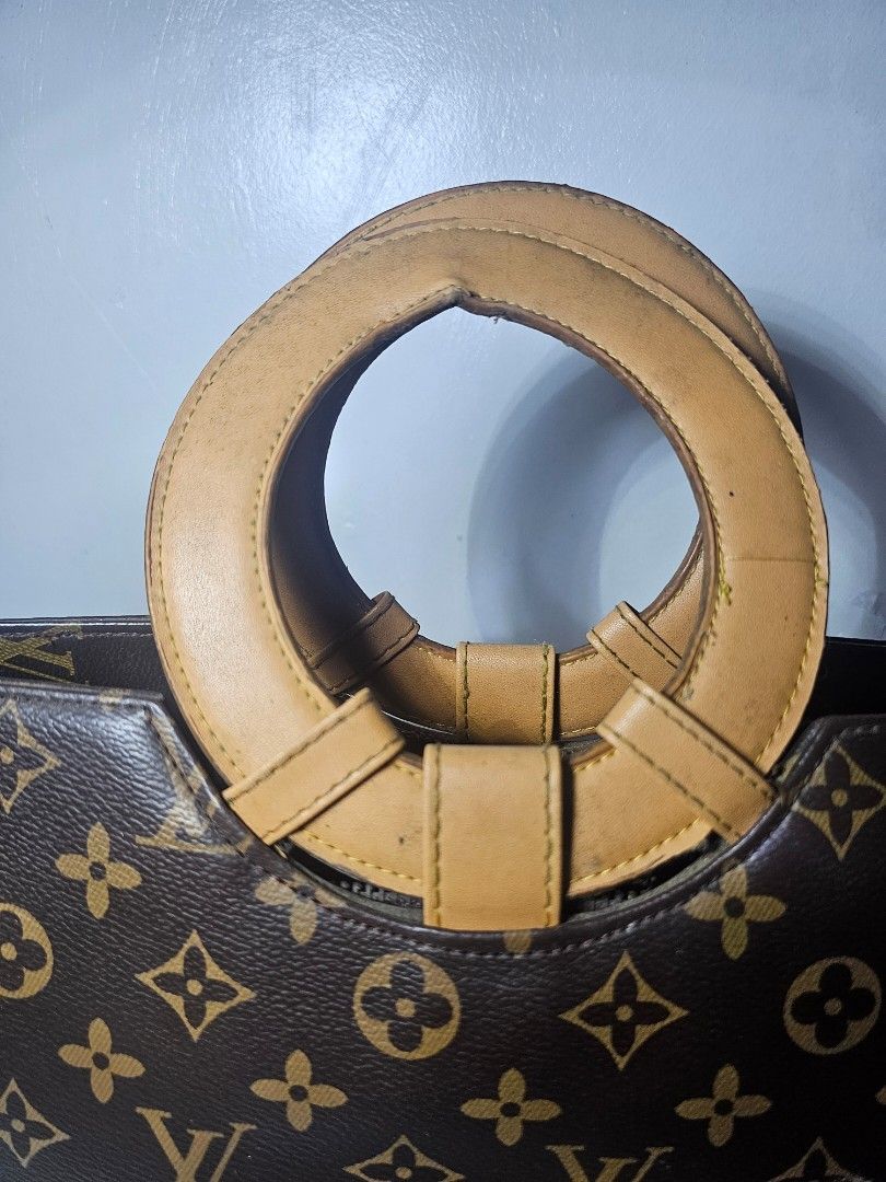 Brown monogram handbag with Circular Handle (Category: Luxury Bags & Wallets) located in Marikina City. Submitted by lalala60325 (Listing ID 1461292778, Image 3). Description: Brown monogram handbag minimal marks on handle and leather but still in good Condition Can send Vid for bag Condition.