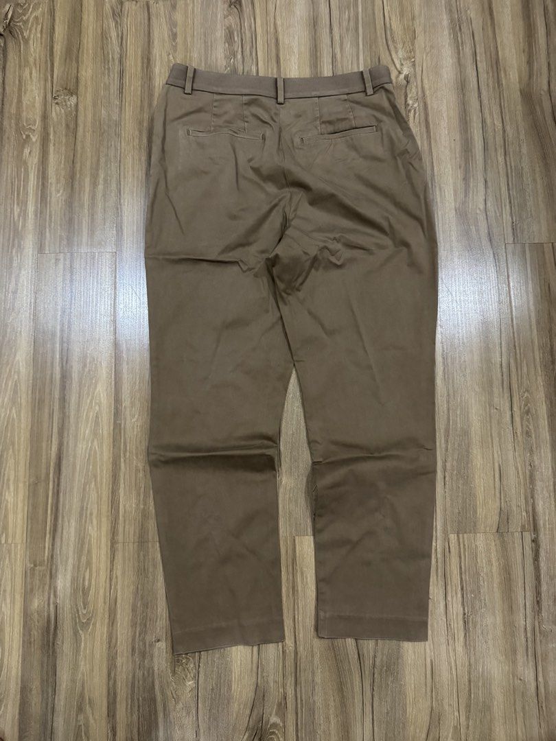 Brown Uniqlo Slacks (Category: Other Bottoms) located in Manila. Submitted by pousey (Listing ID 1461264266, Image 3). Description: - Uniqlo Slacks for formal/informal events - Dark-ish Brown - Features 4 Pockets - Features no zip, no button design - Features Elastic Waistband - Slim Fit - Comfortable for everyday wear - Versatile addition to your wardrobe.