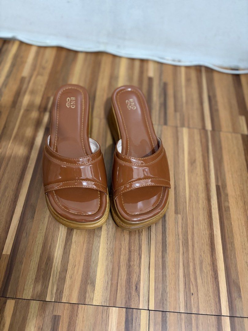 Brown Wedge Sandals (Category: Flats & Sandals) located in Quezon City. Submitted by sctph2024 (Listing ID 1461256138, Image 2). Description: - Cute brown wedge sandals - Shiny patent strap material - Easy slip-on style - Adds a bit of height with wedge heel(2inches) - Versatile for casual or dressy occasions - Comfortable for walking.