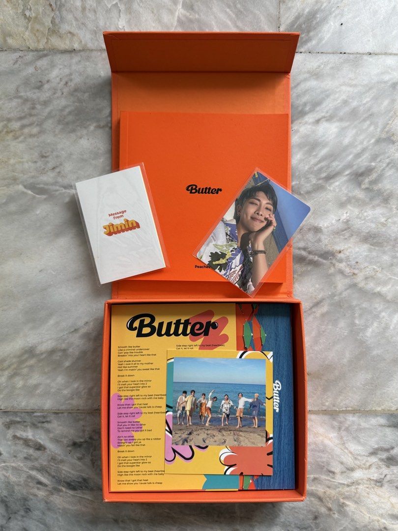 BTS Butter Album (Peaches) (Category: CDs & DVDs) located in San Mateo. Submitted by aifoslvdr (Listing ID 1461130624, Image 2). Description: - BTS Butter Album (Peaches) - Complete set: CD, photobook, message card - Includes exclusive RM photocard - All items are in the original box.