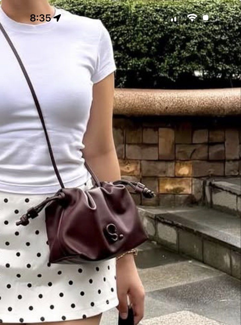 Burgundy Drawstring Bag with 'S' Logo (Category: Luxury Bags & Wallets) located in Manila. Submitted by mongosoleigh (Listing ID 1461265989, Image 1). Description: - Cute burgundy drawstring bag - Subtle 'S' logo on the front - Adjustable strap for comfort - Ideal for carrying daily essentials - Matches well with casual outfits.