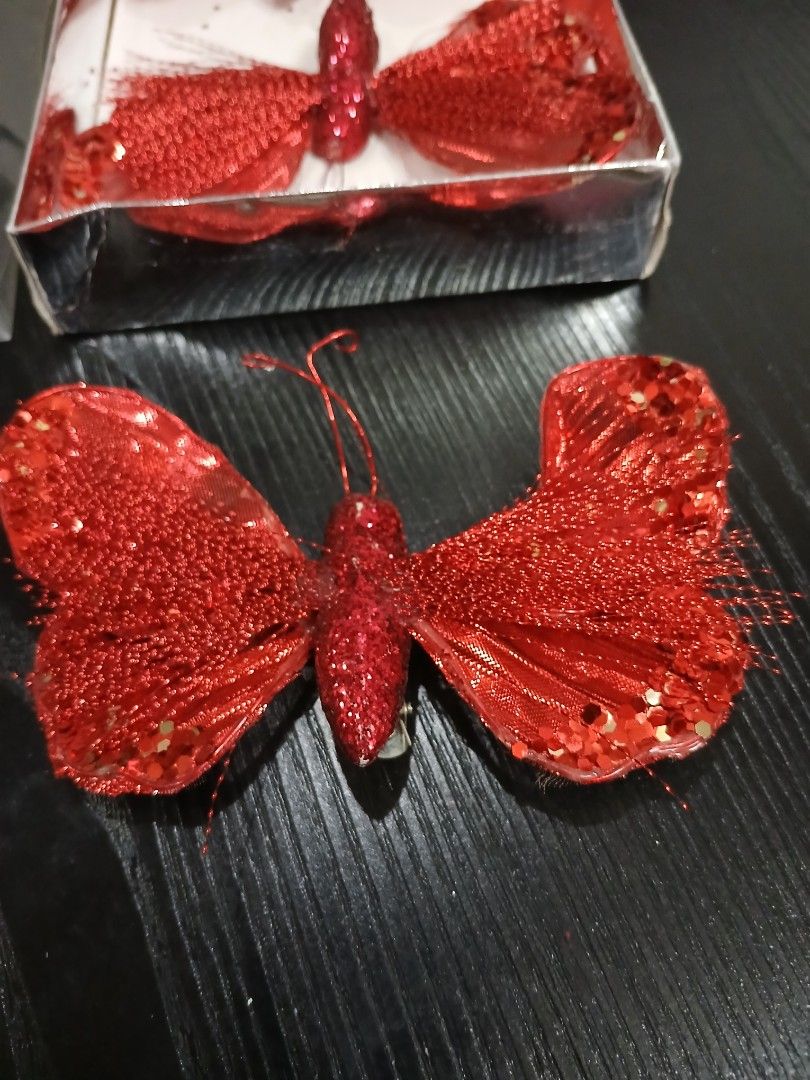 Butterfly Christmas Ornaments (Category: Other Home Decor) located in Davao. Submitted by ferdipt (Listing ID 1461128066, Image 3). Description: A 4-pack of red glittery butterfly clip-on Christmas tree ornaments from the Winter Wonderland collection at Big Lots..