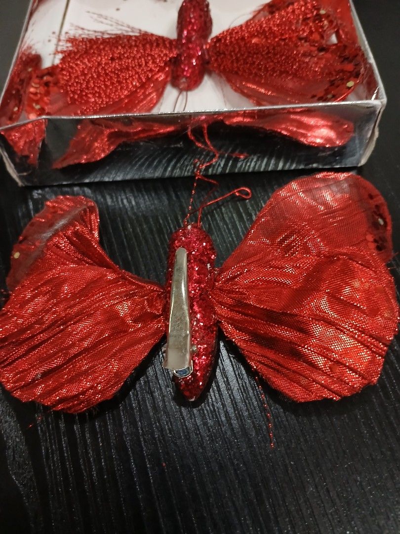 Butterfly Christmas Ornaments (Category: Other Home Decor) located in Davao. Submitted by ferdipt (Listing ID 1461128066, Image 2). Description: A 4-pack of red glittery butterfly clip-on Christmas tree ornaments from the Winter Wonderland collection at Big Lots..