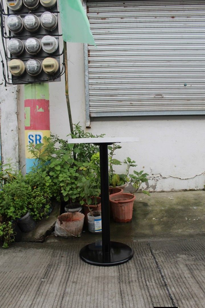 Cafe Bistro Table (Category: Tables & Sets) located in Meycauayan. Submitted by marygracecasimiro (Listing ID 1461227584, Image 2). Description: Round Cafe Bistro Table Modern round cafe-style table with a glossy white tabletop, sturdy black pedestal base and heavy circular footing. Space-saving and perfect for cafes, dining areas, breakfast nooks, balconies or office breakrooms L:19 ¾ • W:19 ¾ • H:33 ½ inches 4,000 pesos only🧡.