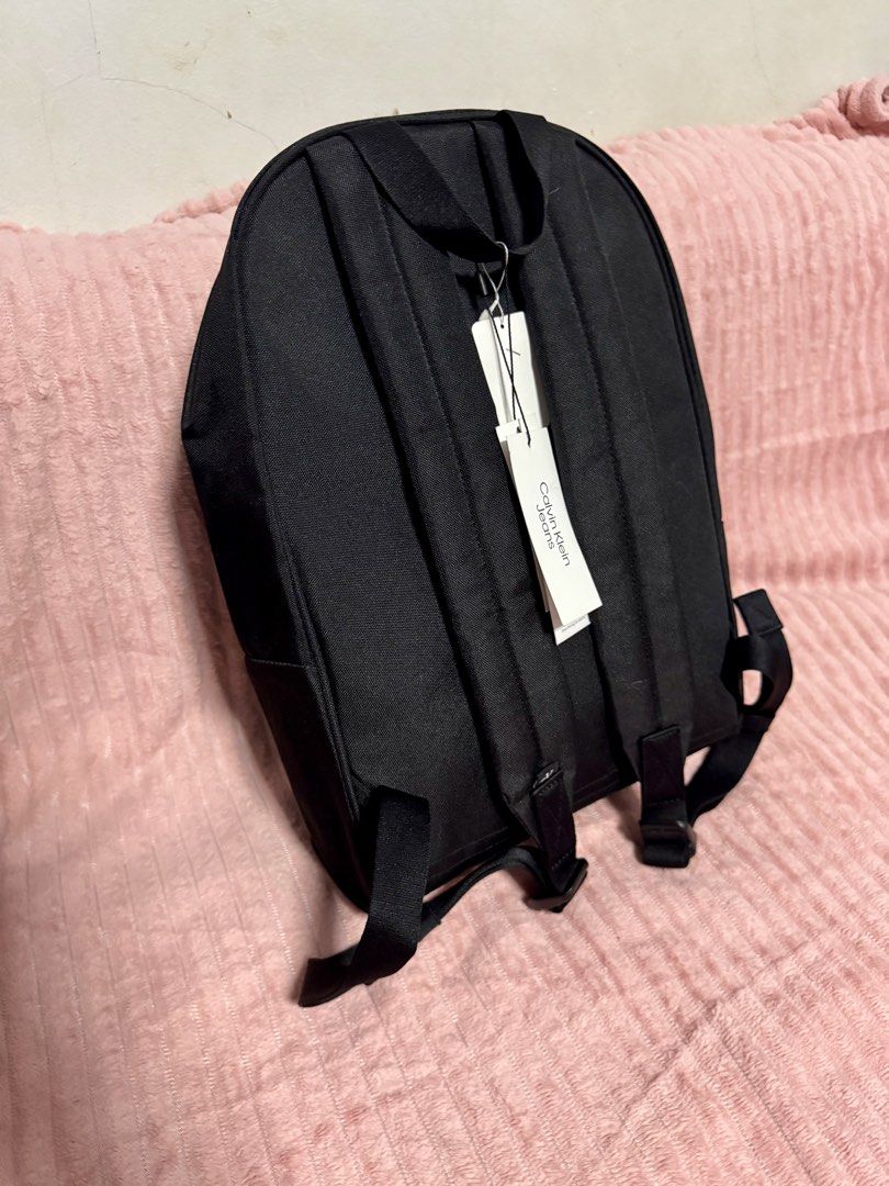 CALVIN KLEIN JEANS BACKPACK (Category: Laptop Bags & Sleeves) located in Taguig. Submitted by shopbyluna18 (Listing ID 1461317020, Image 3). Description: Brand New with Tags ✨ Original Calvin Klein Jeans ✨ Classic black design — easy to match with any outfit ✨ Spacious main compartment ✨ Front zip pocket for quick-access essentials ✨ Comfortable adjustable shoulder straps ✨ Perfect for school, work, travel & everyday use .