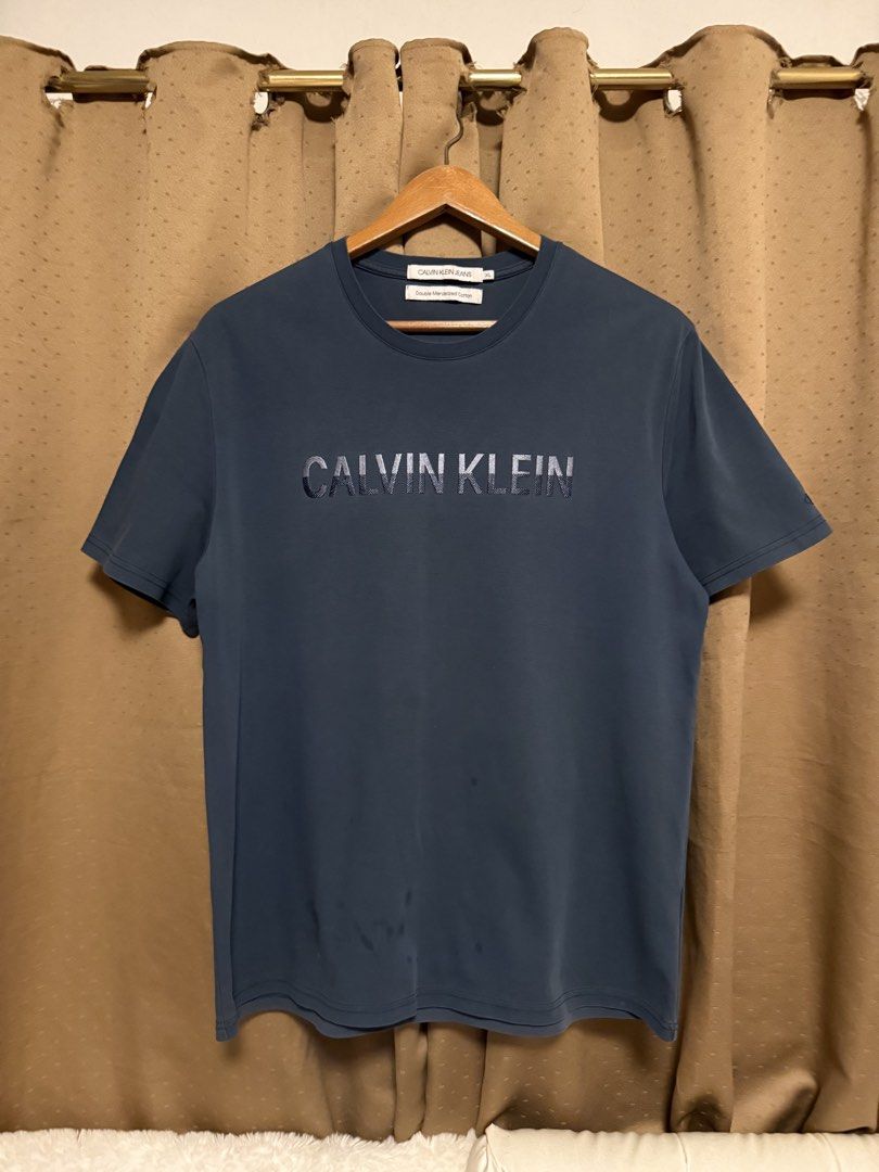 Calvin Klein shirt XL (Category: Tshirts & Polo Shirts ) located in Cavite. Submitted by _solidolo (Listing ID 1461289820, Image 1). Description: 30 x 23 large to xl like new ( oil stains minor flaw).