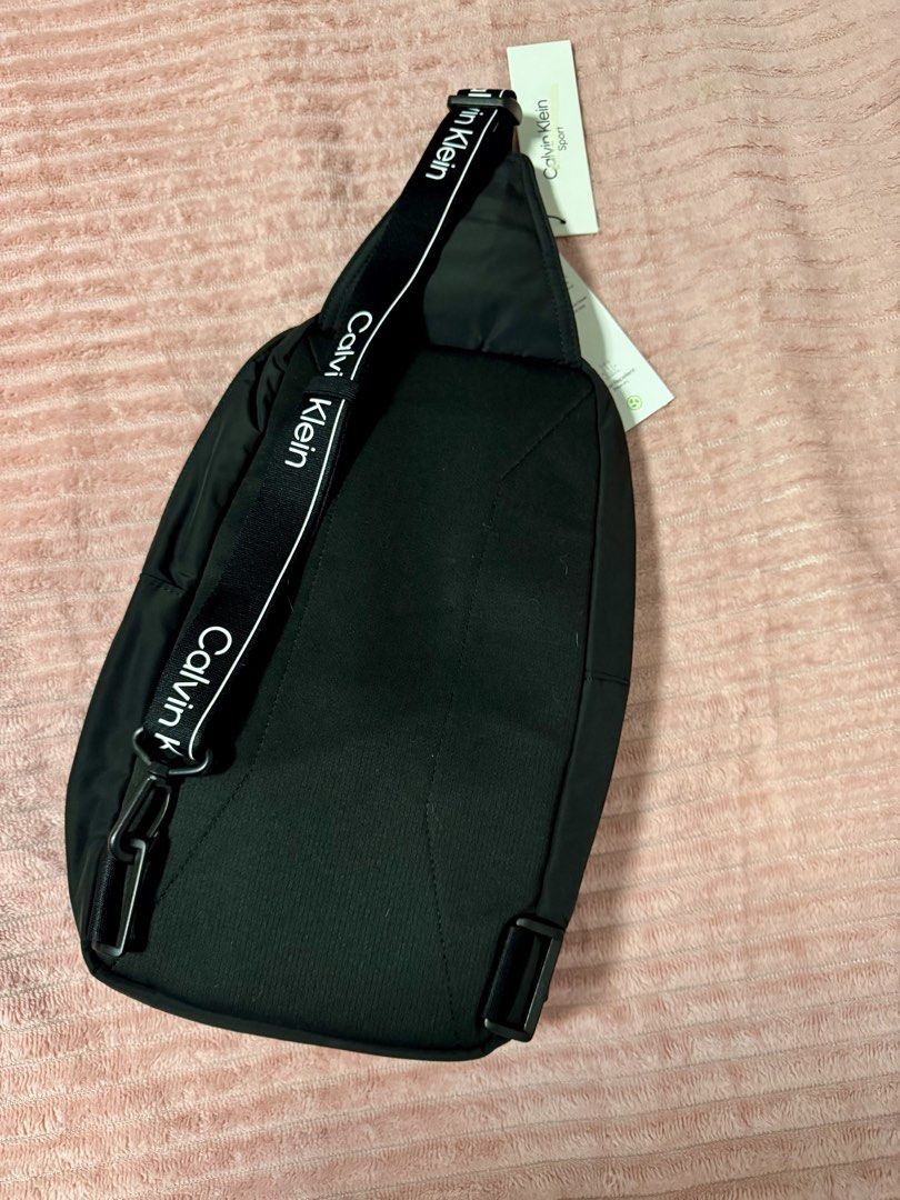 CALVIN KLEIN SLING BAG (Category: Sling Bags) located in Taguig. Submitted by shopbyluna18 (Listing ID 1461316345, Image 2). Description: CALVIN KLEIN SLING BAG — FOR SALE! 🖤 ✨ Brand New / With Tags ✨ Authentic Calvin Klein Sport ✨ Sleek & minimalist black design ✨ Multiple compartments for easy organization ✨ Adjustable strap ✨ Perfect for everyday use, travel, errands & OOTD 🤍 ✨ Lightweight but spacious enough for your essentials 📦 Condition