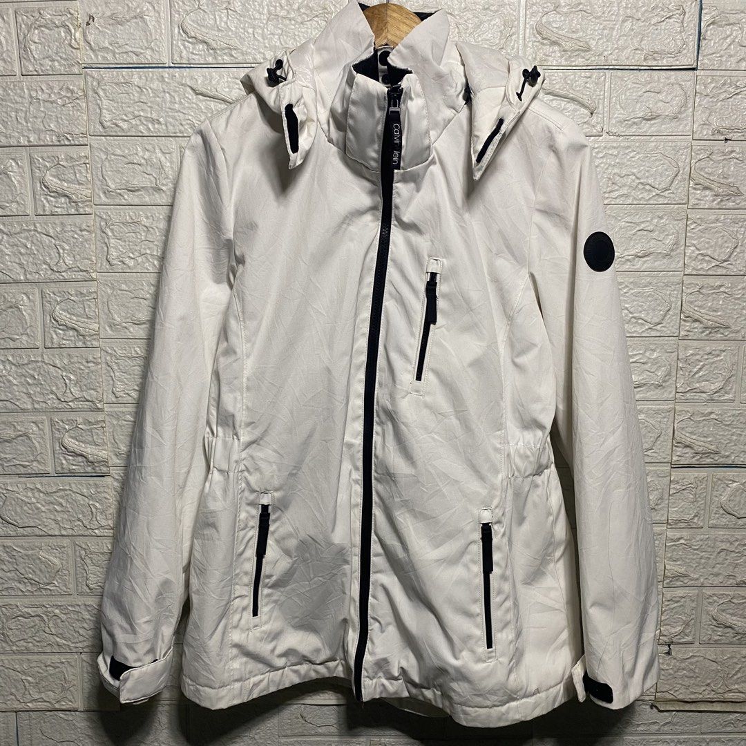 Calvin Klein White Hooded Jacket (Category: Coats, Jackets and Outerwear) located in Naga. Submitted by thesource4400 (Listing ID 1461291018, Image 1). Description: - White Calvin Klein jacket - Hooded with adjustable drawstring - Zip-up front closure - Multiple zip pockets for secure storage - Black logo detail on sleeve - Black logo zipper pull - Ideal for layering.