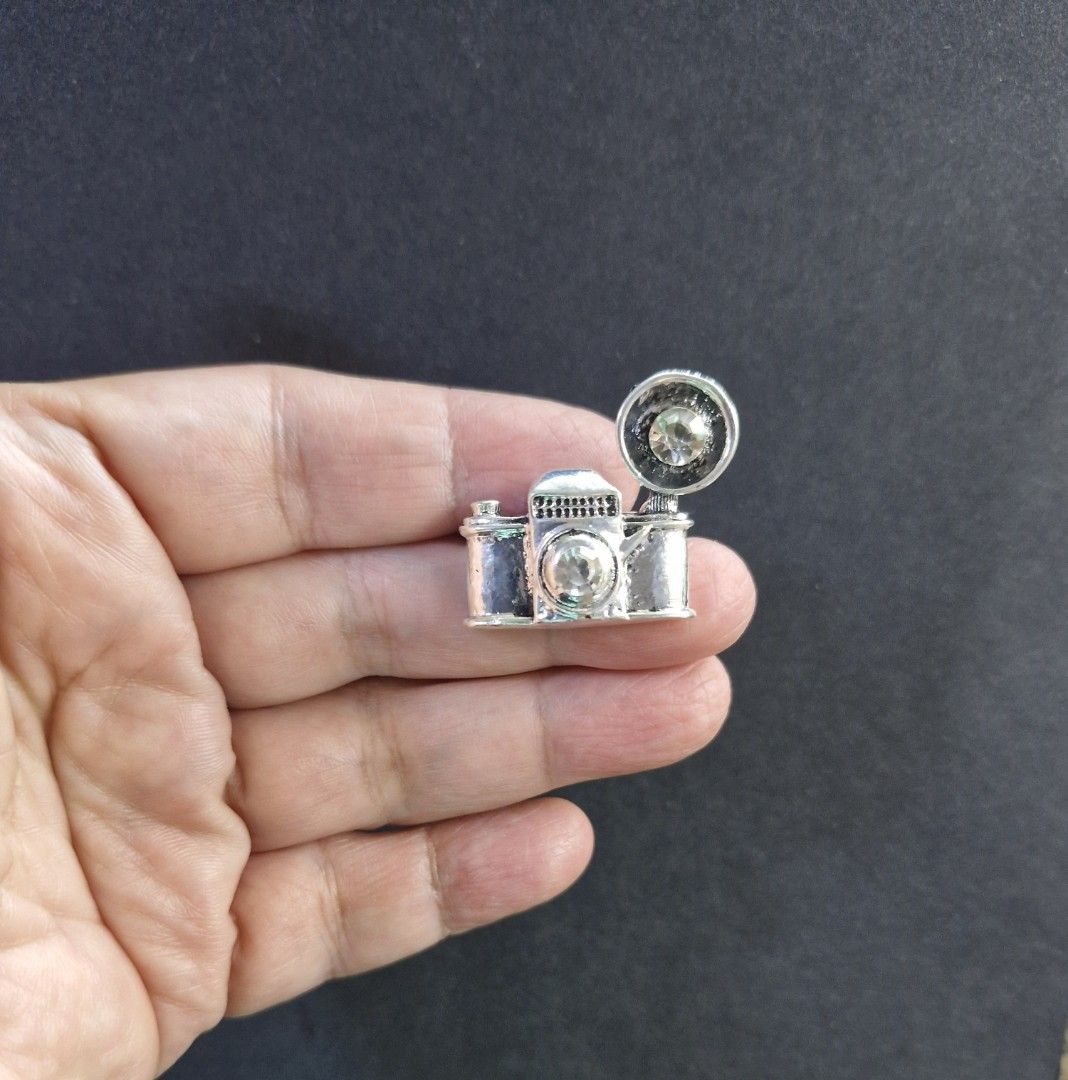 Camera Brooch (Category: Brooches) located in Taguig. Submitted by mommaschoice (Listing ID 1461291501, Image 2). Description: Brand New Unisex use Beautifully crafted design Lightweight won't damage fabric Small brooch Ships nationwide.