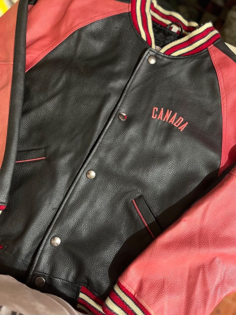 Canada Varsity Jacket - Red & Black Leather Sleeves (Category: Coats, Jackets and Outerwear) located in Baguio. Submitted by astreet_finds26 (Listing ID 1461150897, Image 3). Description: - Classic varsity jacket style - 'CANADA' embroidered on the back - Red leather sleeves - Black body - Ribbed collar, cuffs, and hem - Snap button closure - Two front pockets - Ideal for casual wear direct pm on my blue app Asliah Maruhom or text 0924 594 8539.