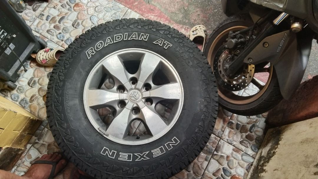 Car Tires (Category: Mags and Tires) located in Quezon City. Submitted by ajmirzenterprises (Listing ID 1461284020, Image 3). Description: - Brand: Nexen - Model: Roadian AT - Size: 265/70R16 - Quantity: 4 tires - Tread: Aggressive all-terrain pattern for excellent grip - DOT Date: 4118 (4th week of 2018).