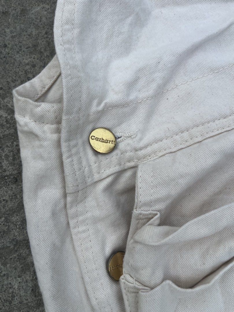Carhartt White Canvas Bib Overalls (Category: Coats, Jackets and Outerwear) located in Manila. Submitted by zentree_04ef04 (Listing ID 1461253748, Image 2). Description: - Classic white Carhartt bib overalls - Durable canvas construction - Iconic Carhartt logo patch - Sturdy brass button closures - Multiple pockets for storage - Ideal for workwear or casual streetwear .