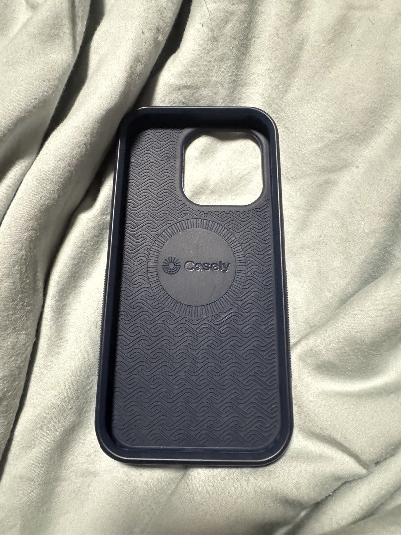 CASELY iPhone 15 Pro Bold Flex Case (Category: Cases & Sleeves) located in Quezon City. Submitted by saaam0 (Listing ID 1461148048, Image 3). Description: MagSafe compatible. There is a slight finish difference from the MagSafe at the back where Popsocket is usually placed. Not visible unless you look for it. RFS: Decluttering MOP: Gcash, BDO.