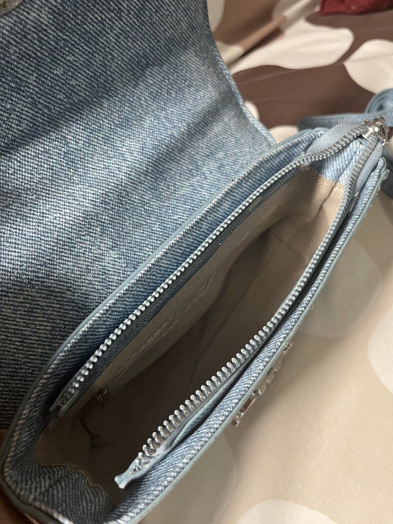Celine Triomphe Denim Crossbody Bag (Category: Luxury Bags & Wallets) located in Las Pinas. Submitted by erenrosc (Listing ID 1461133397, Image 3). Description: - Stylish denim crossbody bag - Silver hardware accents - Main compartment for essentials - Interior zip pocket for security - Comes with two interchangeable straps (long and short) - Ideal for everyday adventures.