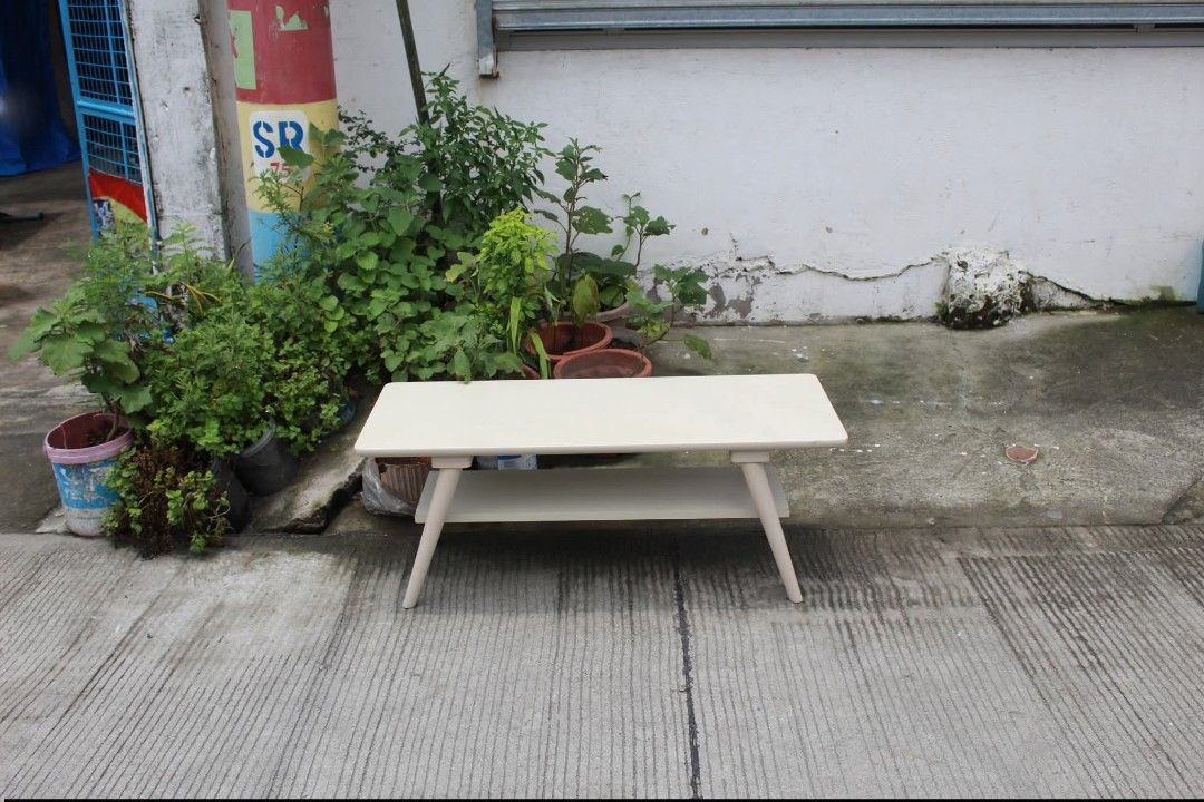 Center Table (Category: Tables & Sets) located in Meycauayan. Submitted by marygracecasimiro (Listing ID 1461228073, Image 2). Description: NITORI 2-Tier Coffee / Center Table Modern 2-tier white coffee table with rounded corners, a spacious lower shelf and sleek tapered wooden legs. Perfect for living rooms, condos or lounge areas L:39 ½ • W:15 ¾ • H:16 inches 3,000 pesos only🧡.