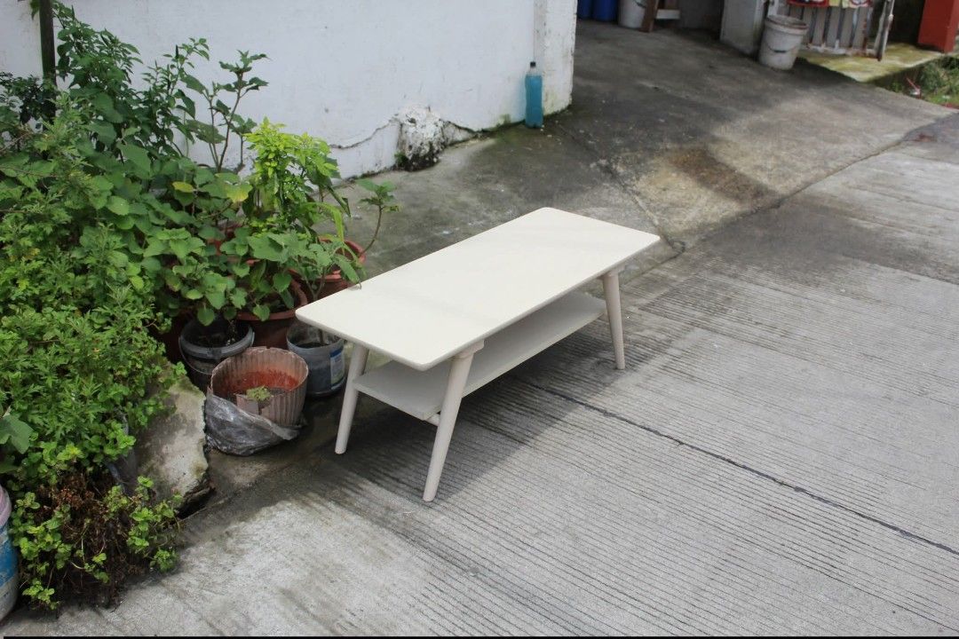 Center Table (Category: Tables & Sets) located in Meycauayan. Submitted by marygracecasimiro (Listing ID 1461228073, Image 3). Description: NITORI 2-Tier Coffee / Center Table Modern 2-tier white coffee table with rounded corners, a spacious lower shelf and sleek tapered wooden legs. Perfect for living rooms, condos or lounge areas L:39 ½ • W:15 ¾ • H:16 inches 3,000 pesos only🧡.