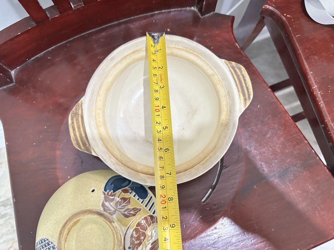 Ceramic Pot with Lid (Category: Cookware & Accessories) located in Caloocan City. Submitted by kianoto (Listing ID 1461148762, Image 2). Description: - Elegant ceramic pot with lid - Convenient side handles for easy carrying - Features a decorative patterned design - Approximately 8 inches in diameter - Ideal for both cooking and serving dishes.