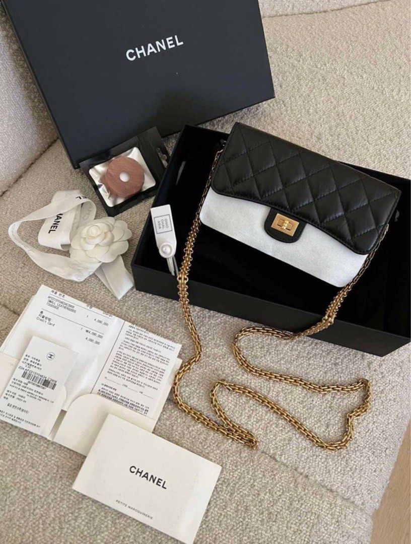 Chanel 22.5 Wallet On Chain (Category: Luxury Bags & Wallets) located in Manila. Submitted by poshgirlph (Listing ID 1461286921, Image 1). Description: - Chanel WOC - Color: Black and white quilted leather - Strap: Gold chain - Condition: Purchased in 2022 - Includes: Original box, dust bag, authenticity card, and receipt - Perfect for carrying essentials.