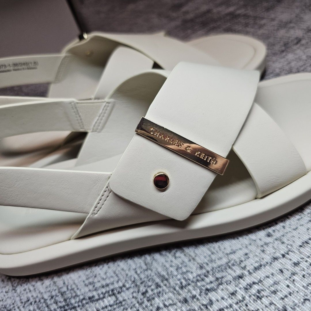 Charles & Keith Audra Crossover Slingback Sandals (Category: Flats & Sandals) located in Palayan City. Submitted by rvllssx (Listing ID 1461149825, Image 2). Description: Brand new Charles & Keith Audra Crossover Sling Back Sandals 🔸️Color: Chalk 🔸️Size: 38 🔸️With box and paperbag 🔸️Bought in SG SRP 3,400 pesos.