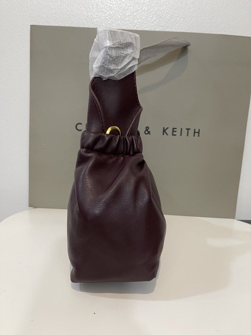Charles & Keith Crossbody Bag - Plum (Category: Cross-body Bags) located in Pasig City. Submitted by preloved.closet2 (Listing ID 1461127977, Image 3). Description: Color Deep Plum With Sling Add paperbag plus 80 .