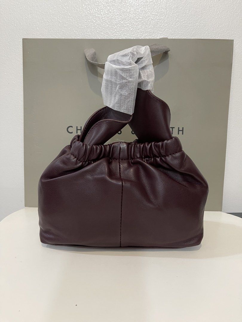 Charles & Keith Crossbody Bag - Plum (Category: Cross-body Bags) located in Pasig City. Submitted by preloved.closet2 (Listing ID 1461127977, Image 1). Description: Color Deep Plum With Sling Add paperbag plus 80 .