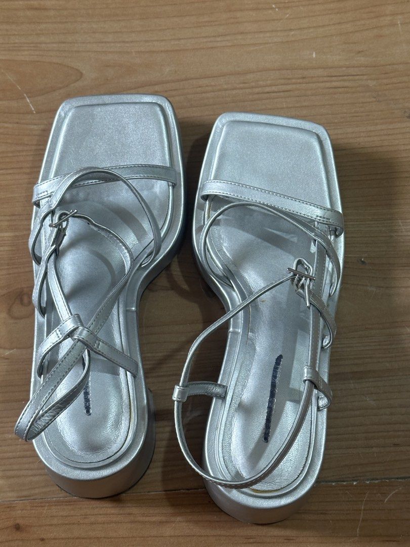 Charles & Keith Silver Strappy Square Toe Sandals Size 36 (Category: Flats & Sandals) located in Manila. Submitted by preloved_by_ea (Listing ID 1461158519, Image 1). Description: - Brand: Charles & Keith - Color: Silver - Style: Strappy Sandals - Toe Shape: Square Toe - Closure: Buckle (adjustable) - Size: 36 - Versatility: Perfect for dressing up or down.