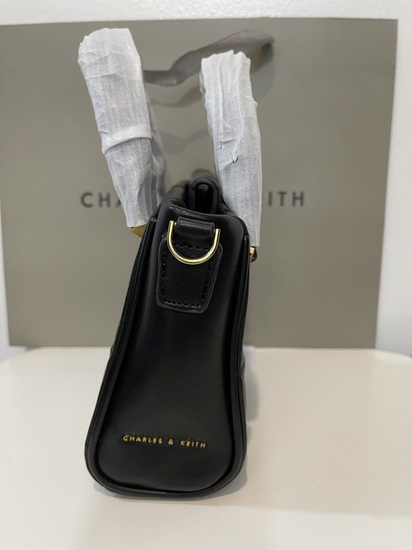 Charles & Keith Top Handle Bag (Category: Cross-body Bags) located in Pasig City. Submitted by preloved.closet2 (Listing ID 1461127683, Image 3). Description: Color Black with Sling Add paperbag plus 80 .