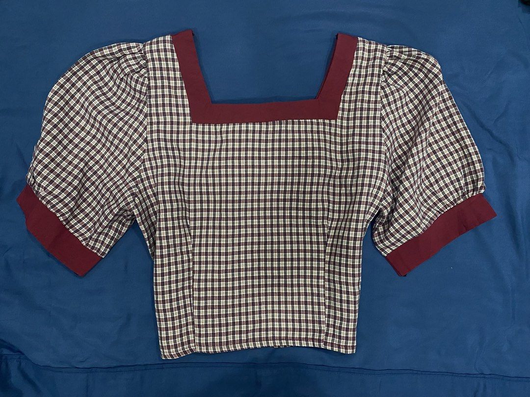 Checkered Puff Sleeve Square Neck Top with Bow Detail (Category: Blouses) located in Manila. Submitted by escherichiaa (Listing ID 1461294621, Image 3). Description: - Adorable checkered top - Features stylish puff sleeves - Elegant square neckline - Cute bow detail at the front - Burgundy trim accents collar, sleeves, and center - Convenient side zipper for easy wear - Perfect for both casual outings and dressed-up events.