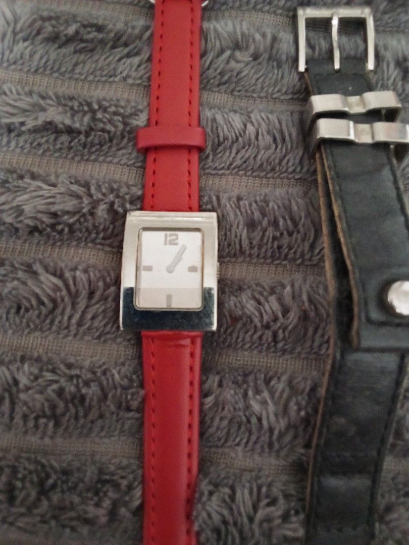 Christian Dior Watch with Red Leather Strap (Category: Women's Watches) located in Quezon City. Submitted by santos2016 (Listing ID 1461178536, Image 1). Description: - Authentic Christian Dior watch - Genuine red leather strap - Silver-toned rectangular watch face - White dial with silver hour markers and hands - Engraved brand details on the back - A sophisticated and stylish accessory not working- kayo na po magpa ayos.