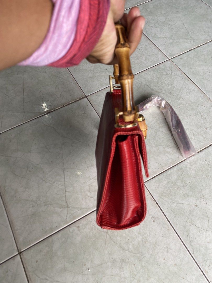 Clamori Firence 1955 rare bag (Category: Luxury Bags & Wallets) located in Muntinlupa City. Submitted by twoangels.11.14.2023 (Listing ID 1461193571, Image 3). Description: lizard printed Calfskin leather Bamboo handle Small Adjustable leather shoulder strap Measures: 18x15x8,5 cm Excellent condition .