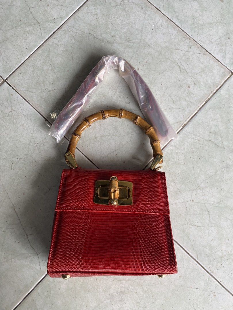Clamori Firence 1955 rare bag (Category: Luxury Bags & Wallets) located in Muntinlupa City. Submitted by twoangels.11.14.2023 (Listing ID 1461193571, Image 1). Description: lizard printed Calfskin leather Bamboo handle Small Adjustable leather shoulder strap Measures: 18x15x8,5 cm Excellent condition .