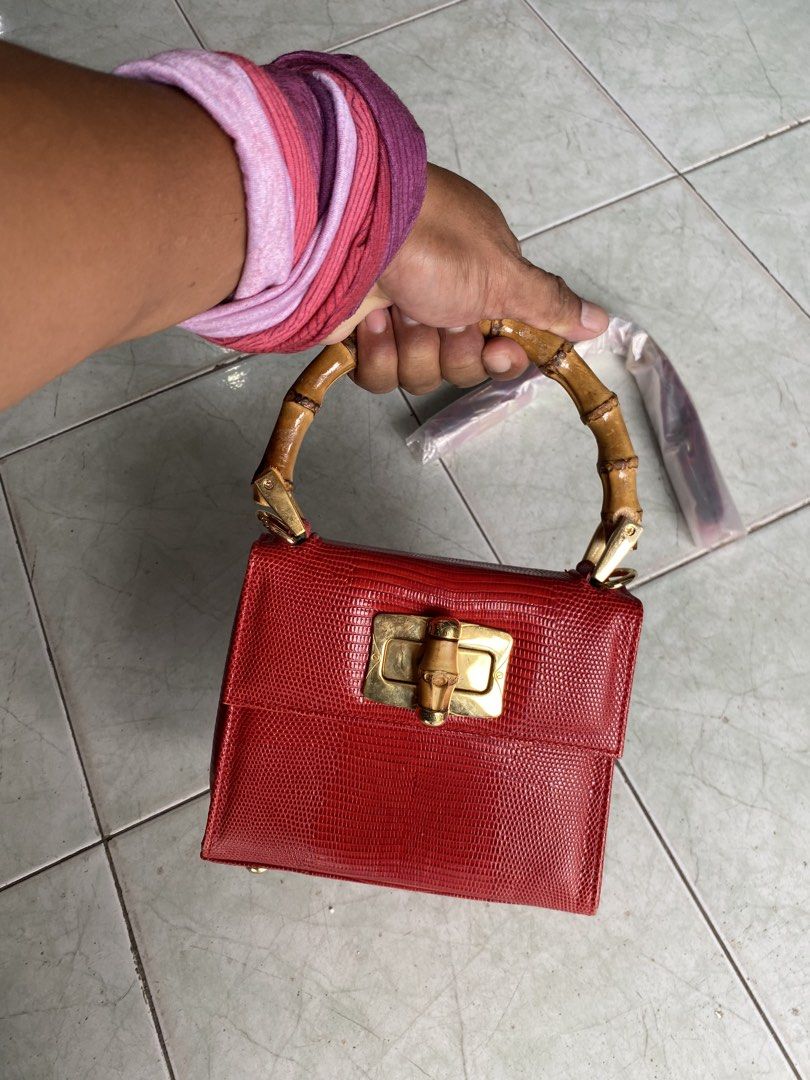 Clamori Firence 1955 rare bag (Category: Luxury Bags & Wallets) located in Muntinlupa City. Submitted by twoangels.11.14.2023 (Listing ID 1461193571, Image 2). Description: lizard printed Calfskin leather Bamboo handle Small Adjustable leather shoulder strap Measures: 18x15x8,5 cm Excellent condition .