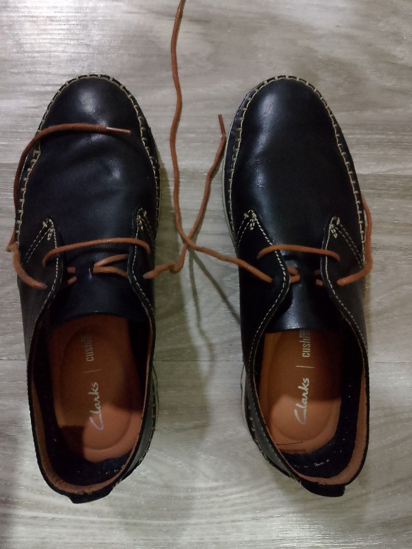 CLARKS MEN'S CASUAL SHOES (Category: Casual Shoes) located in Caloocan City. Submitted by pvaliao (Listing ID 1461224083, Image 2). Description: A pair of black brown leather Clarks casual loafer shoes with contrast stitching and brown laces. Preloved.