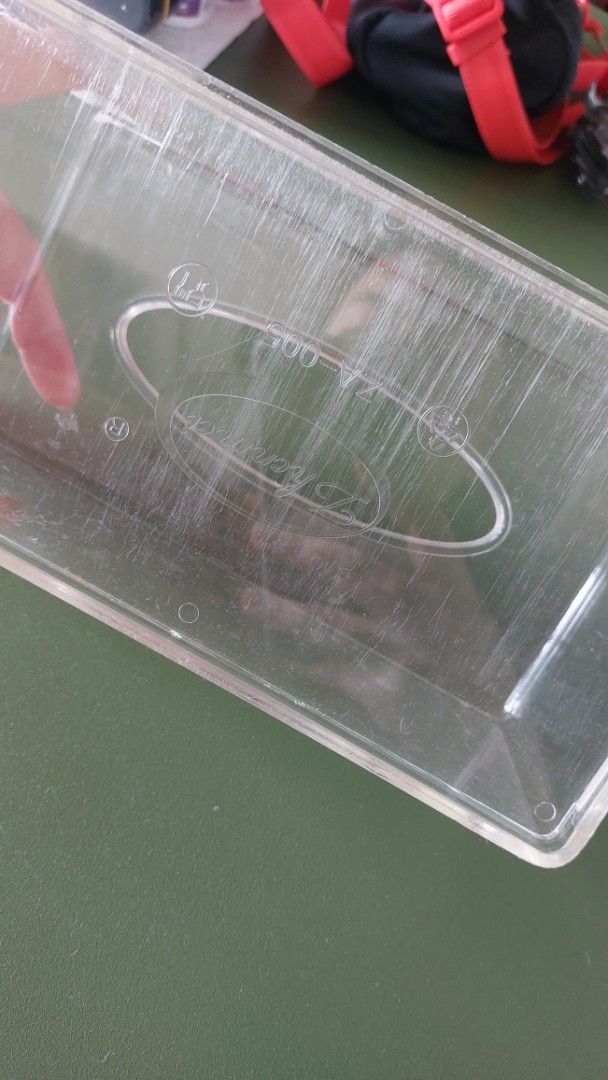 Clear Plastic Tissue Box Holder Cover Case (Category: Storage Boxes & Baskets) located in Taguig. Submitted by sdavid1988 (Listing ID 1461185908, Image 2). Description: - Clear plastic tissue box holder - Dimensions: 8.5 inches long, 4.4 inches wide, 3.5 inches high - Fits standard rectangular tissue boxes - Keeps tissues organized and easily accessible - Minor scratches from use, but fully functional - Perfect for any room in your home.