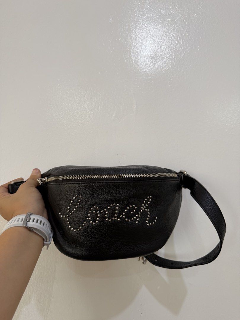 Coach Black Leather Studded Belt Bag (Category: Belt bags, Clutches and Pouches) located in Manila. Submitted by escarchame98247 (Listing ID 1461162011, Image 1). Description: -Brand new! With dust bag - Authentic Coach black leather belt bag - Features studded 'Coach' detailing on the front - Secure silver zipper closure - Adjustable strap for versatile wear - Perfect for hands-free convenience - Can be worn around the waist or crossbody.