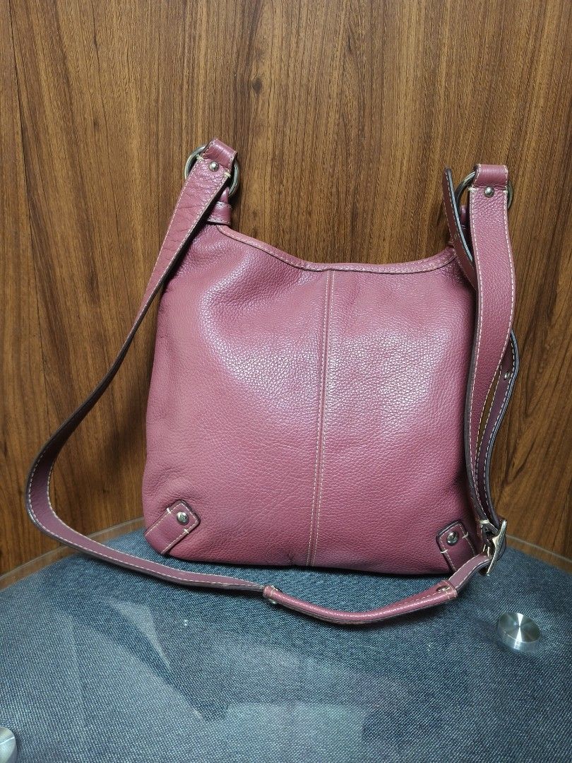 Coach leather convertible crossbody (Category: Shoulder Bags) located in Baguio. Submitted by PreiLoveMaria (Listing ID 1461245480, Image 3). Description: Authentic Coach leather convertible crossbody and shoulder bag (Style No. F14679) crafted from soft, textured mauve-pink pebbled cowhide leather with contrast stitching and silver-tone hardware. It features a matching adjustable strap, an exterior front zip pocket with a leather pull, a secure 