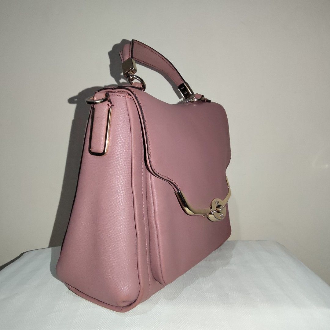 Coach Madison Small Sadie Satche (Category: Shoulder Bags) located in Antipolo. Submitted by keshmeres (Listing ID 1461237650, Image 3). Description: With minimal creasing on the folded areas and some fading/signs of use on the bottom. Faded color/paint on the back. Comes with a replacement shoulder/sling strap. Clean interior. Hardware has some scratches but still retains its gold color..