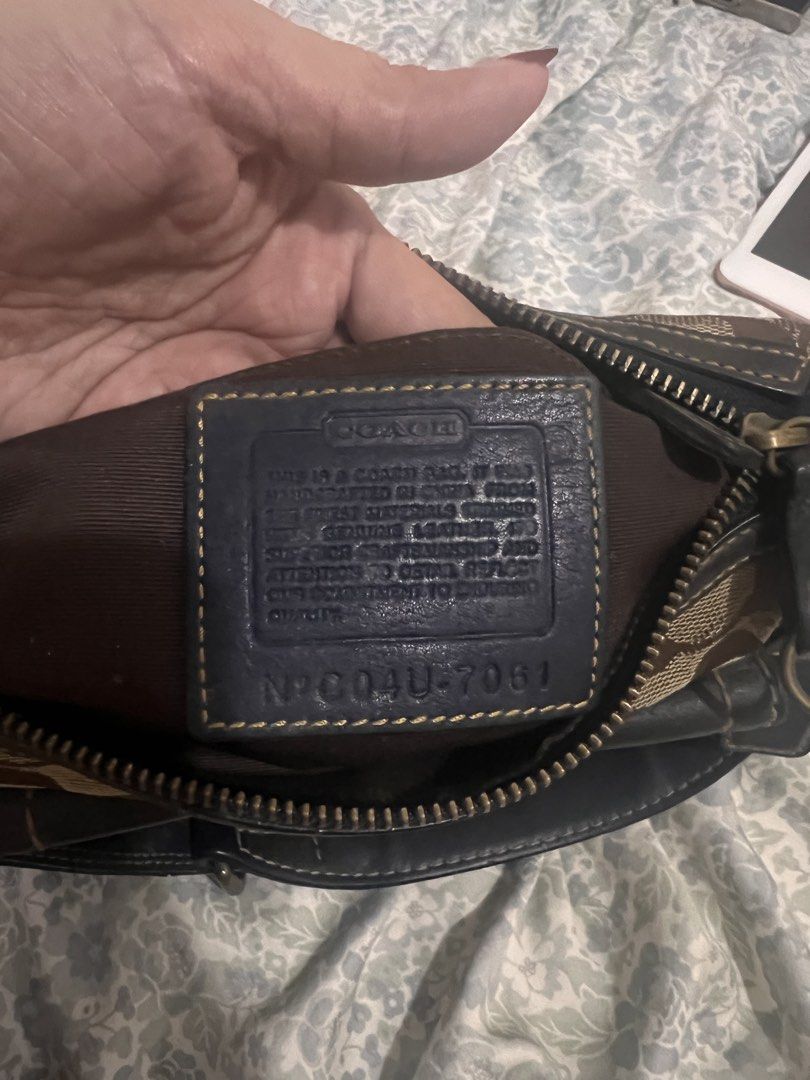 Coach Monogram Canvas Leather Trim Shoulder Bag (Category: Luxury Bags & Wallets) located in Antipolo. Submitted by ninaaisha (Listing ID 1461228679, Image 3). Description: - Authentic brown vintage Coach monogram canvas shoulder bag - Stylish black leather trim and buckle detail on front pocket - Secure zipper closure - Interior Coach leather tag with serial number - Adjustable strap with clip for comfortable wear - Compact and perfect for every