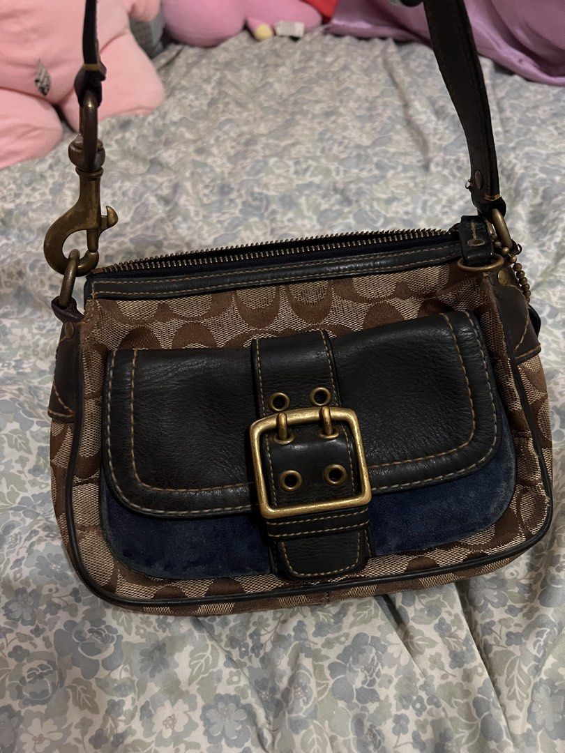 Coach Monogram Canvas Leather Trim Shoulder Bag (Category: Luxury Bags & Wallets) located in Antipolo. Submitted by ninaaisha (Listing ID 1461228679, Image 1). Description: - Authentic brown vintage Coach monogram canvas shoulder bag - Stylish black leather trim and buckle detail on front pocket - Secure zipper closure - Interior Coach leather tag with serial number - Adjustable strap with clip for comfortable wear - Compact and perfect for every