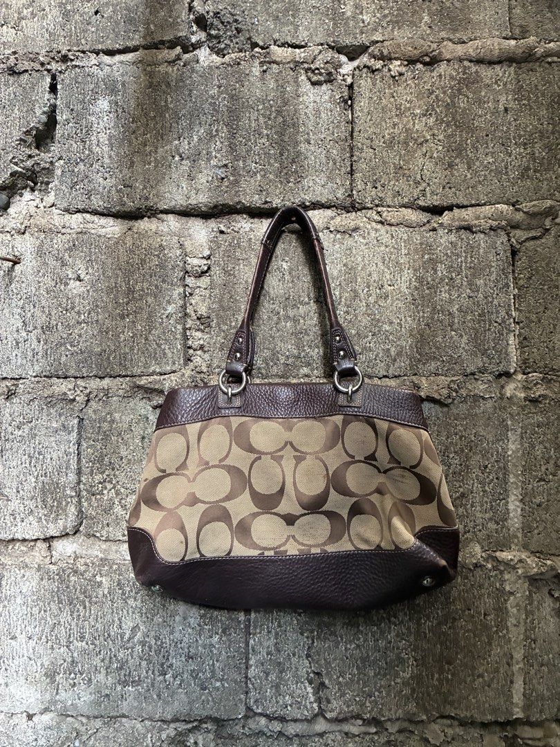 Coach Monogram Canvas Leather Trim Shoulder Bag (Category: Luxury Bags & Wallets) located in Manila. Submitted by assortedgoodsv3 (Listing ID 1461307914, Image 2). Description: - Classic Coach shoulder bag - Brown monogram canvas with dark brown leather trim - Zippered top closure - Interior zippered pocket and slip pockets - Clean lining - Spacious and perfect for everyday use.