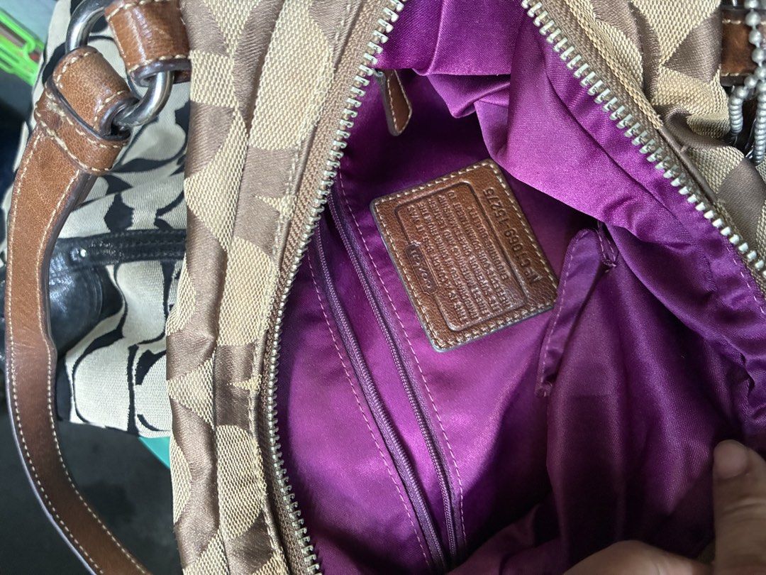 Coach Monogram Canvas Leather Trim Shoulder Bag (Category: Luxury Bags & Wallets) located in Manila. Submitted by assortedgoodsv3 (Listing ID 1461308071, Image 3). Description: - Authentic Coach bag - Classic brown and tan monogram pattern - Genuine leather trim and handles - Luxurious purple satin interior lining - Zippered main compartment for security - Interior zip pocket for organization - Comes with original Coach hang tag - Ideal everyday 