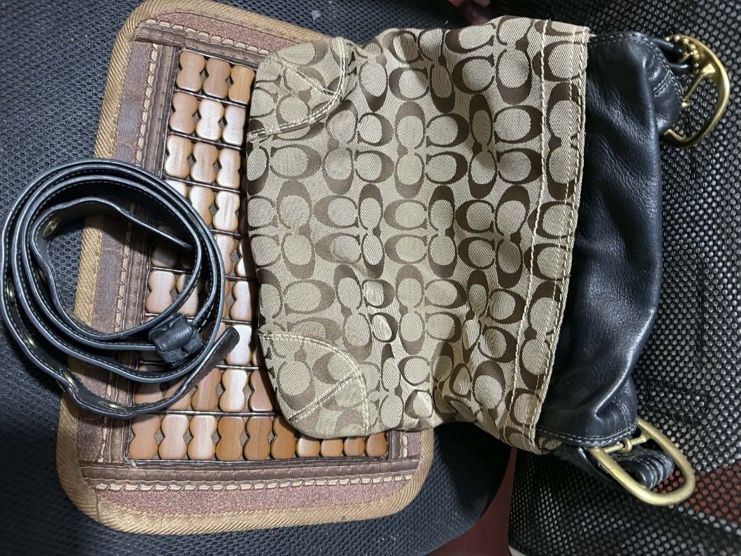 Coach Monogram Leather Shoulder Bag with Belt (Category: Luxury Bags & Wallets) located in Manila. Submitted by cruznarlyn63507 (Listing ID 1461164457, Image 2). Description: Chic Coach monogram canvas shoulder bag with black leather accents and gold hardware. Features a secure flap closure with buckle, interior zip pocket, and authenticity tag. Includes a matching black leather belt. Shows some wear on leather trim and strap..