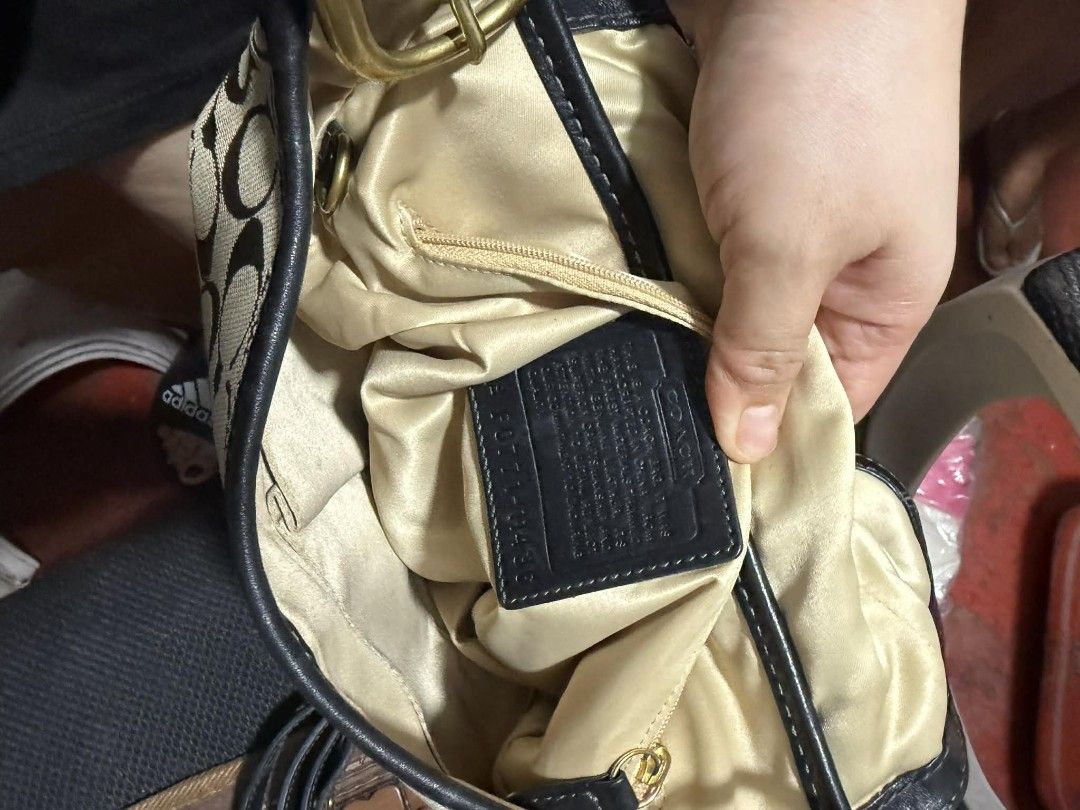 Coach Monogram Leather Shoulder Bag with Belt (Category: Luxury Bags & Wallets) located in Manila. Submitted by cruznarlyn63507 (Listing ID 1461164457, Image 3). Description: Chic Coach monogram canvas shoulder bag with black leather accents and gold hardware. Features a secure flap closure with buckle, interior zip pocket, and authenticity tag. Includes a matching black leather belt. Shows some wear on leather trim and strap..