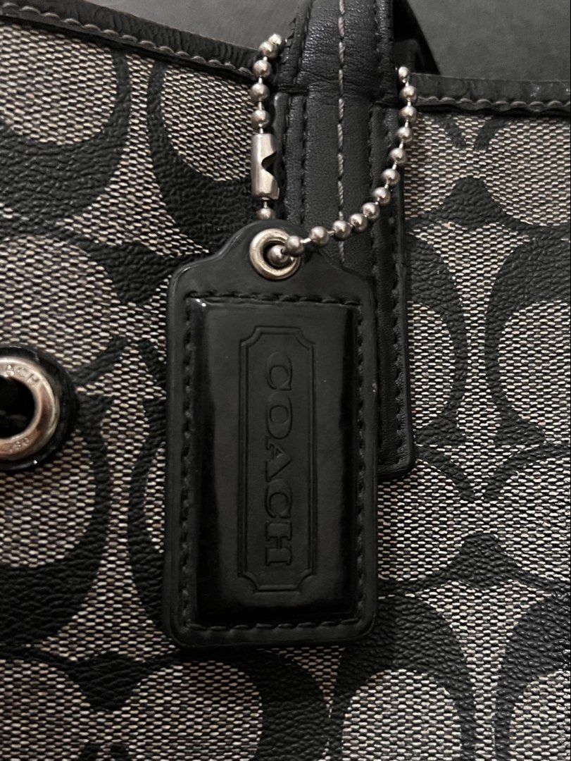 Coach Monogram Tote Bag (Category: Luxury Bags & Wallets) located in Manila. Submitted by coachsakura (Listing ID 1461282270, Image 1). Description: - Classic Coach tote bag - Signature monogram pattern (black & grey) - Leather trim and handles - Central stripe detail - Ball chain with Coach tag - Spacious interior for essentials.