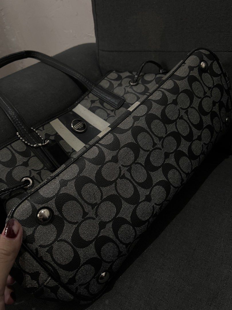 Coach Monogram Tote Bag (Category: Luxury Bags & Wallets) located in Manila. Submitted by coachsakura (Listing ID 1461282270, Image 2). Description: - Classic Coach tote bag - Signature monogram pattern (black & grey) - Leather trim and handles - Central stripe detail - Ball chain with Coach tag - Spacious interior for essentials.