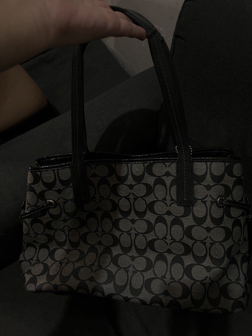 Coach Monogram Tote Bag (Category: Luxury Bags & Wallets) located in Manila. Submitted by coachsakura (Listing ID 1461282270, Image 3). Description: - Classic Coach tote bag - Signature monogram pattern (black & grey) - Leather trim and handles - Central stripe detail - Ball chain with Coach tag - Spacious interior for essentials.